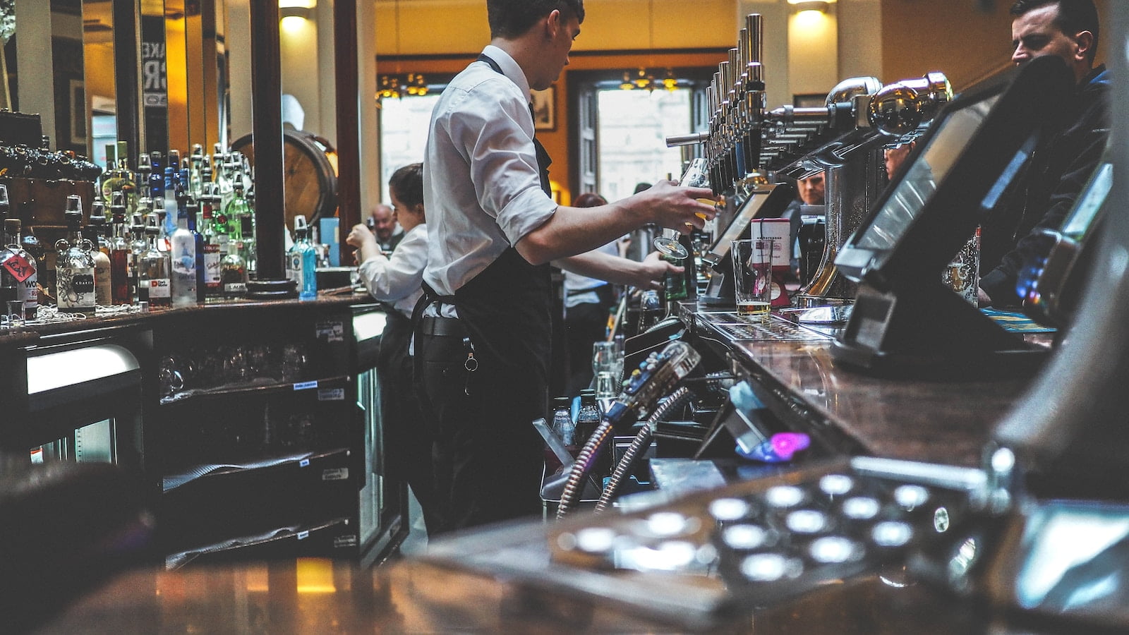 man preparing beverage drink in bar